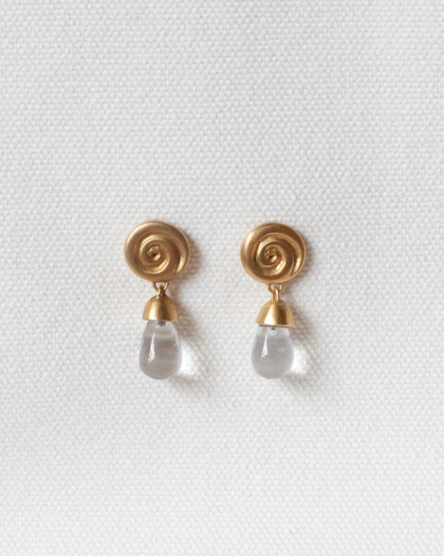 gold spiral earring with spiral design and crystal quartz drop